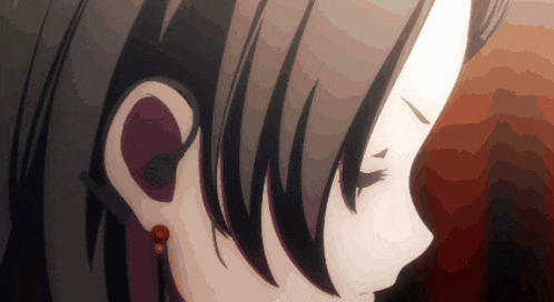 a close up of a girl 's ear with earrings