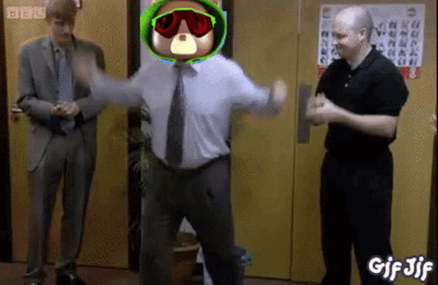 a man in a suit and tie is dancing in front of a bbc sign ..
