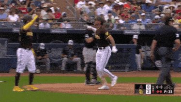 a baseball game is being played with the scoreboard showing a 2-0