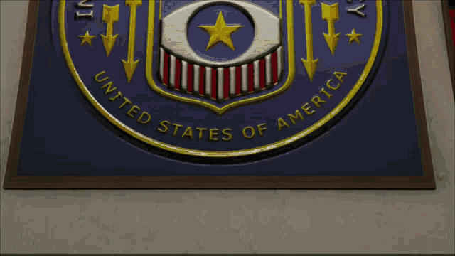 two people shaking hands in front of a flag that says eye