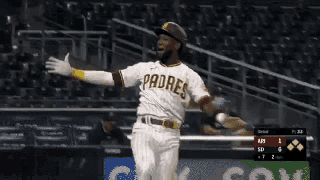 a padres baseball player is running towards home plate