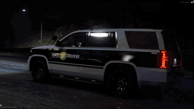 a black and white suv with trooper written on the back