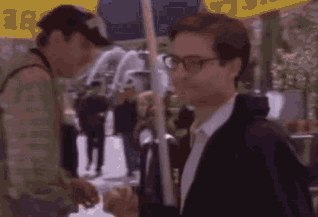 a blurry picture of a man walking down a street