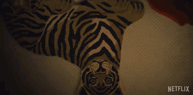 a rug with a tiger on it and the word netflix below it