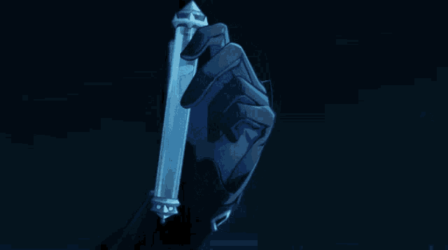 a hand in a black glove is holding a very long object