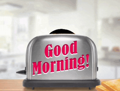 a silver toaster says good morning in red letters