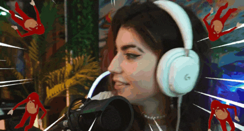 a woman wearing white headphones with the letter g on it