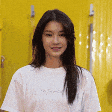 a woman wearing a white shirt that says maverick