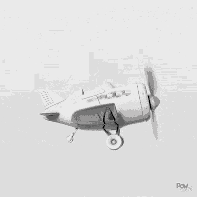 a white airplane with a propeller is flying in the air