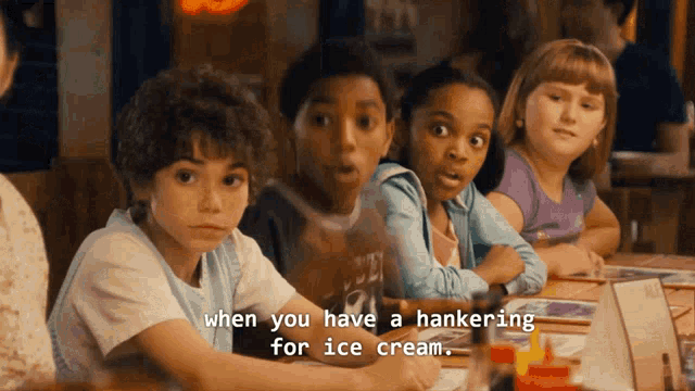 a group of children are sitting at a table with the words " when you have a hankering for ice cream "