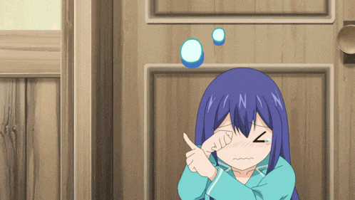 a girl with blue hair is standing in front of a wooden door and covering her eyes with her hand