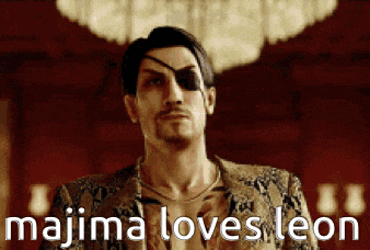 a man with an eye patch on his eye is standing in front of a chandelier and says majima loves leon .