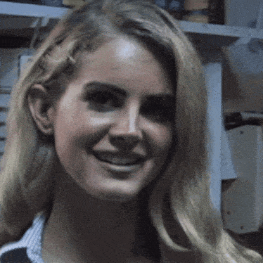 a close up of a woman 's face smiling