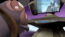 a cartoon character is looking at a computer monitor .
