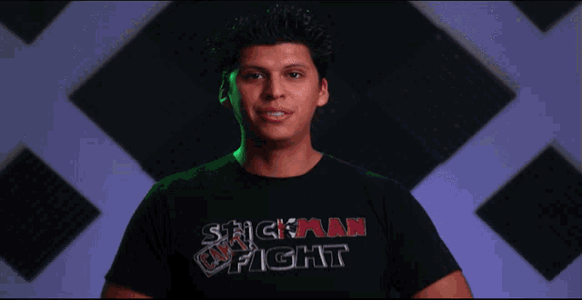 a man wearing a t-shirt that says stickman fight