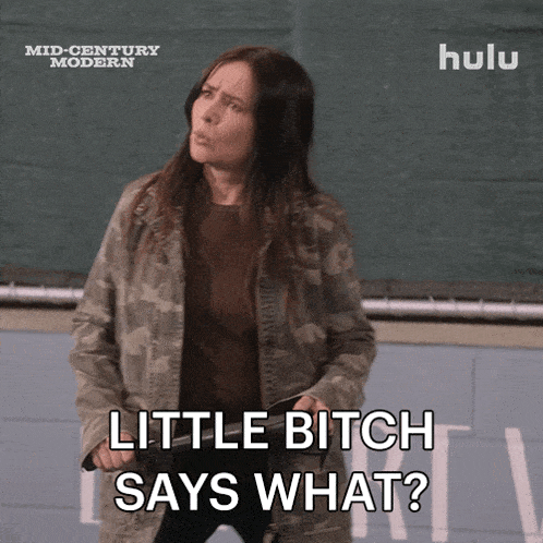a woman in a camouflage jacket is holding a knife and says " little bitch says what "