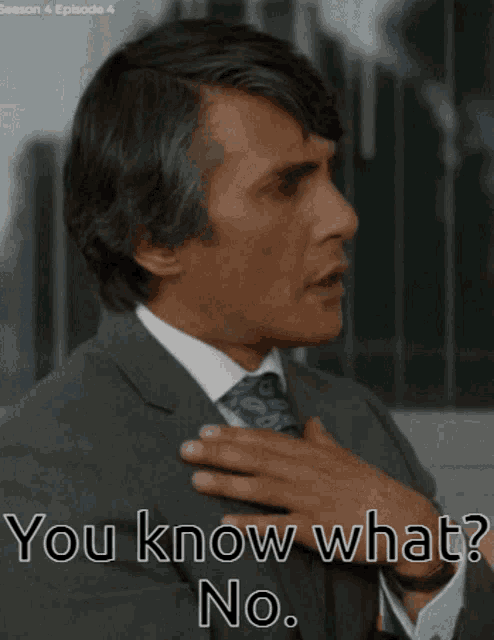 a man in a suit and tie says " you know what "