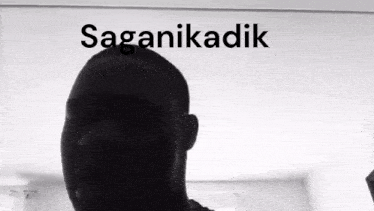 a black and white photo of a man 's head with the words saganikadik above him