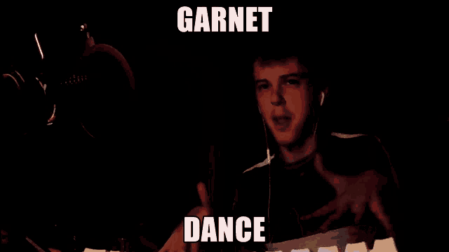a man is dancing in the dark with garnet dance written above him