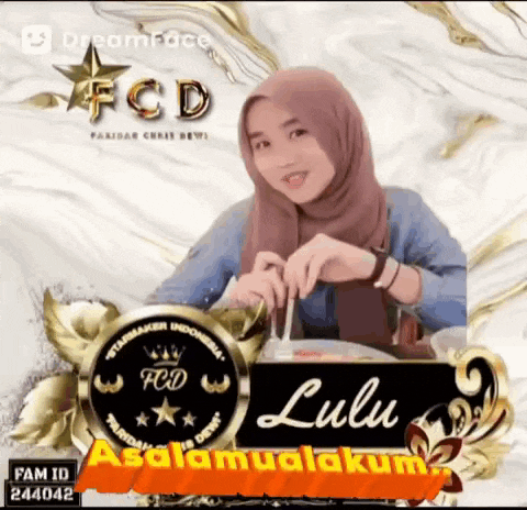 a girl wearing a hijab is sitting at a table with a sign that says lulu