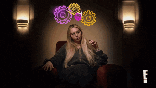 a woman sits in a chair with gears coming out of her head and the letter e in the corner