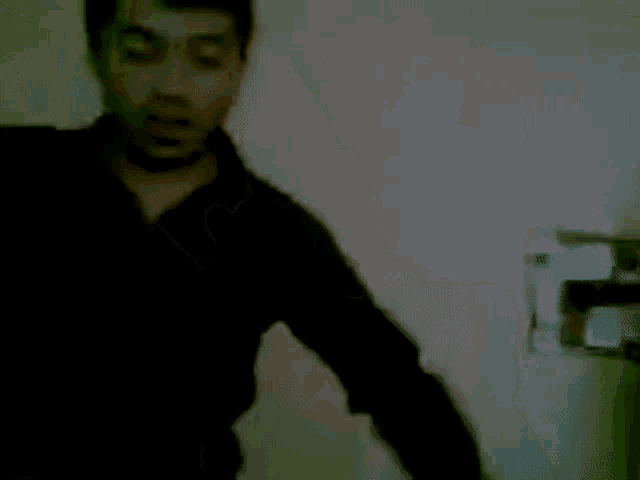 a blurry photo of a man 's face and neck