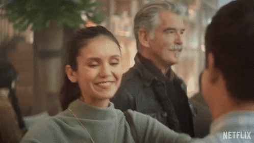 a man and a woman are hugging each other in a netflix ad