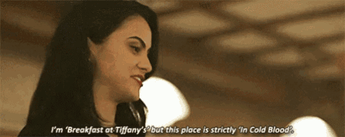 a woman is talking to another woman in a restaurant and says `` i 'm breakfast at tiffany 's '' .