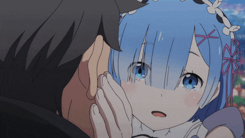 a man touches a girl 's face with his hand