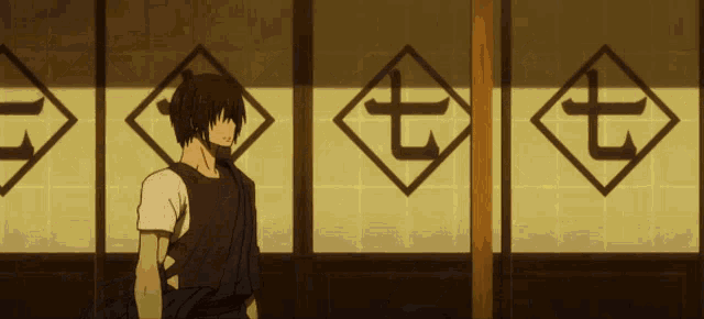 a man in a kimono stands in front of a wall with the number seven on it