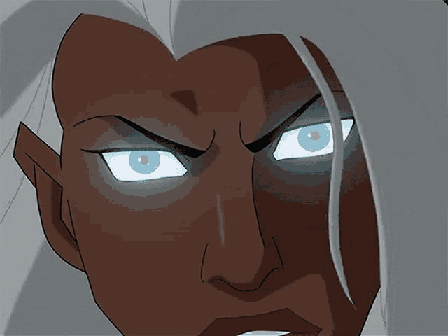 a close up of a person 's face with blue eyes