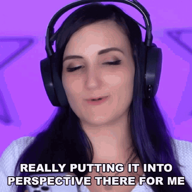 a woman wearing headphones is making a face and says " really putting it into perspective there for me "