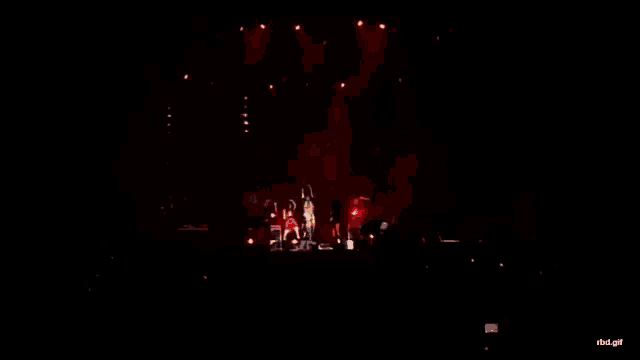 a group of people dancing on a stage with the words rbd.gif written on the bottom
