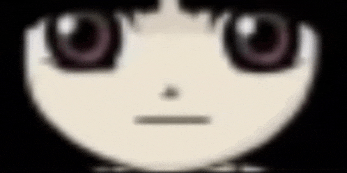 a close up of a person 's face with big eyes and a slight smile .