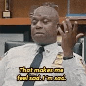 a police officer is sitting in a chair and saying `` that makes me feel sad , i 'm sad .