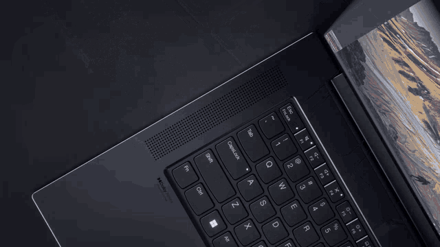 a close up of a laptop keyboard with the shift key on the bottom left