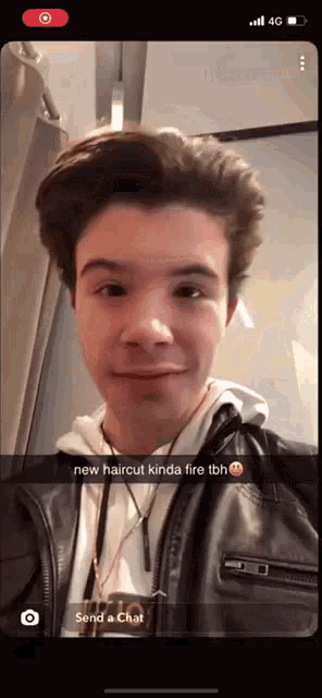 a snapchat of a young man with a new haircut