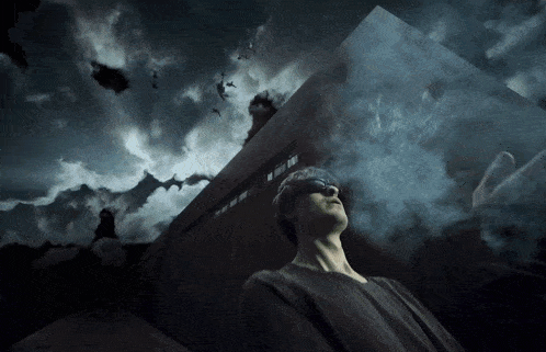 a man wearing blindfolds looks up at the sky