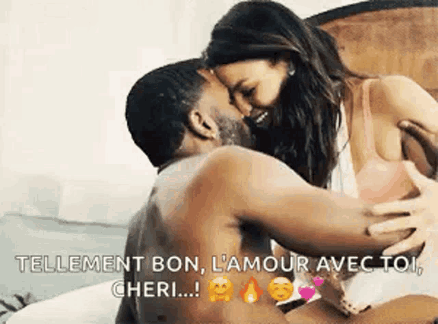 a man and a woman are kissing on a bed with the words tellement bon l' amour avec toi cheri .