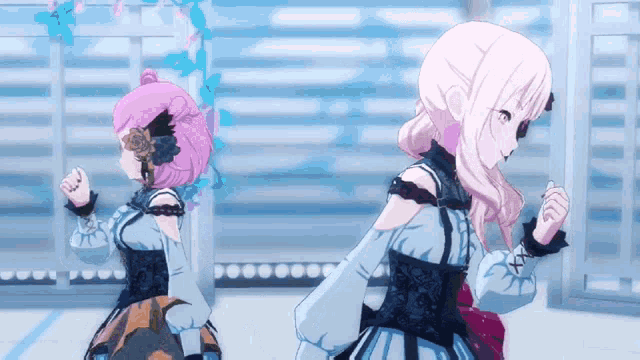 two anime girls standing next to each other in a room