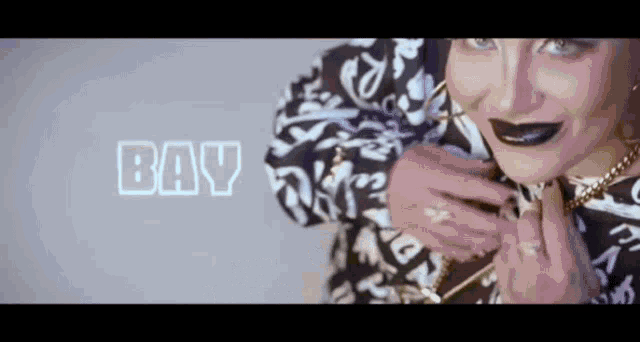 a close up of a woman with the word bay on the bottom