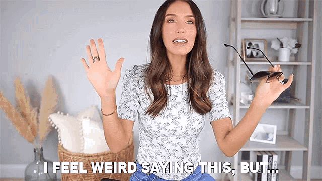 a woman is holding a pair of sunglasses in her hand and says i feel weird saying this but