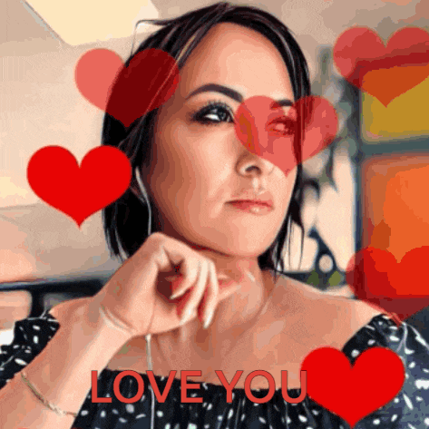 a woman surrounded by red hearts with the words love you