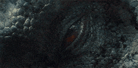 a close up of a dragon 's eye with a red spot