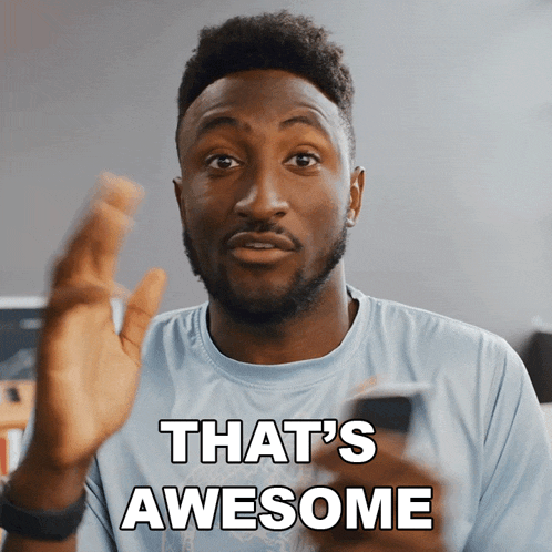 a man holding a cell phone with the words that 's awesome above him
