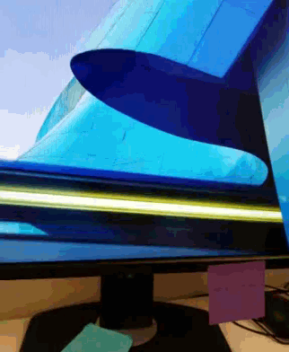 a computer monitor with a blue airplane on the screen