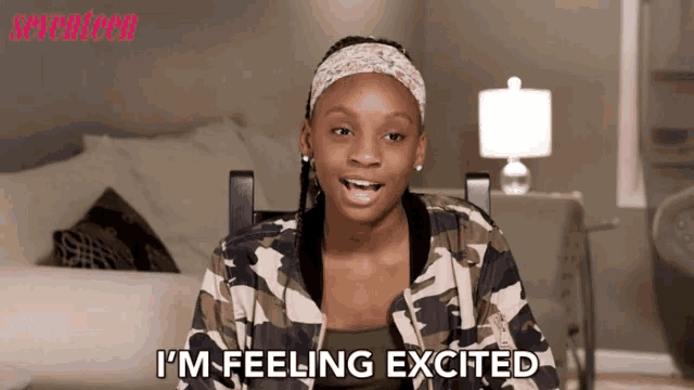 a girl in a camouflage jacket says " i 'm feeling excited "