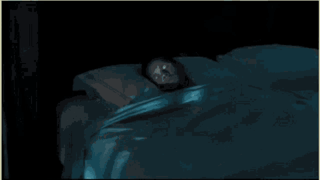a blurry picture of a man in a blue shirt