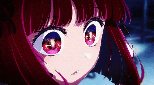 a close up of a girl 's face with red hair