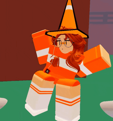 a cartoon character wearing an orange cone hat